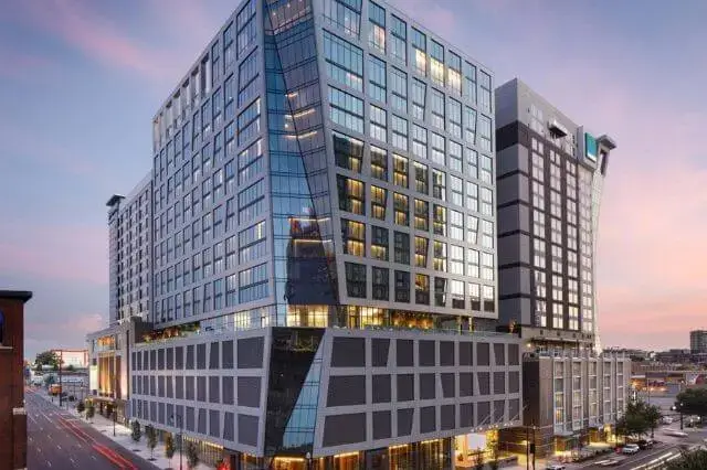 Exterior view of The Joseph, a Luxury Collection Hotel, in Nashville with outdoor pool and terrace.